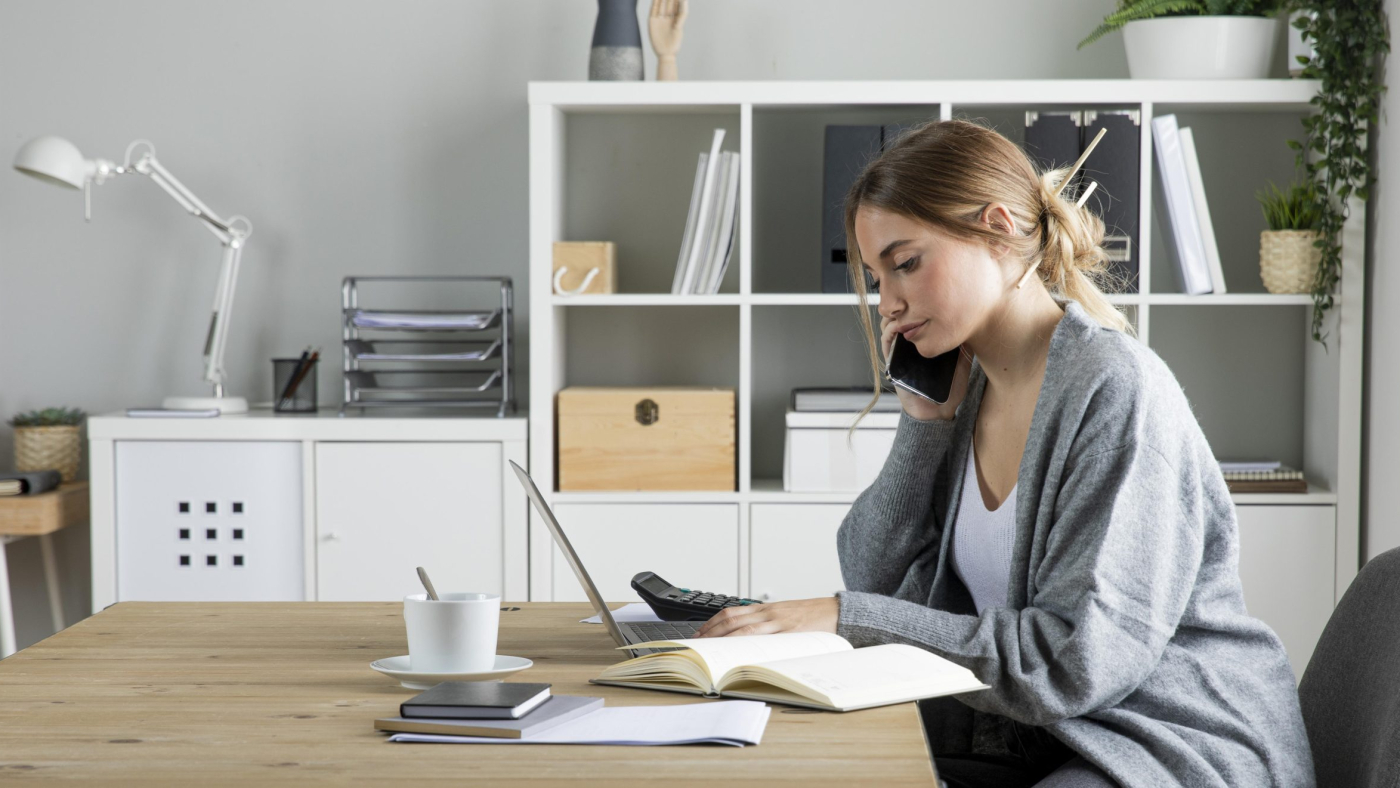 medium-shot-woman-working-with-laptop